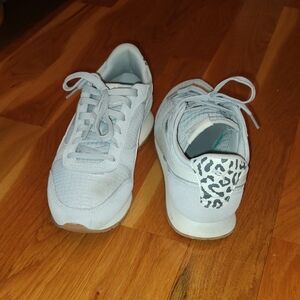 Women's Puma Sneakers with Animal Print Accent.